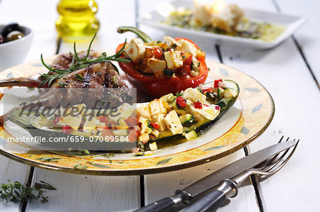 Courgette and peppers stuffed with sheep's cheese, and lamb chops Courgette and peppers stuffed with sheep's cheese, and lamb chops