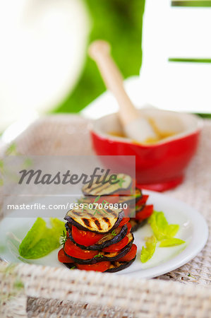 Vegetable stacks of grilled aubergine slices and tomatoes