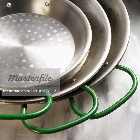 Three Green Handled Pans; Stacked