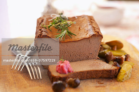 Smooth pâté with pickled vegetables and rosemary