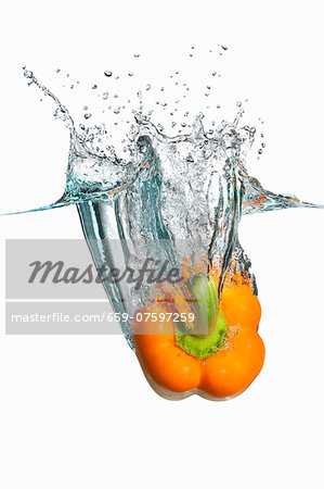 Yellow Bell Pepper Splashing in Water