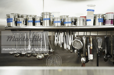 Professional Kitchen; Hanging Tools and Canisters of Seasonings - Stock  Photo - Masterfile - Premium Royalty-Free, Code: 659-07597959