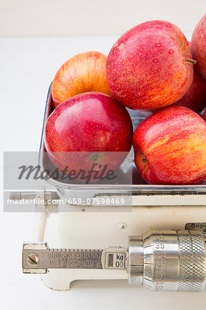 Apples (Royal Gala) on a set of old kitchen scales