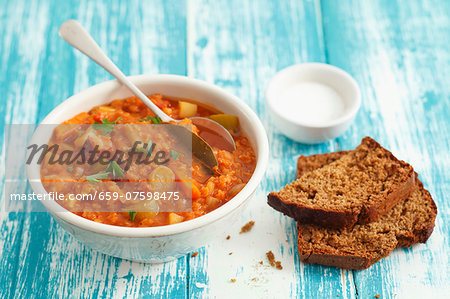 Lentil & tomato stew with pancetta and bread