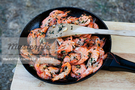 Fried king prawns with garlic and parsley Fried king prawns with garlic and parsley