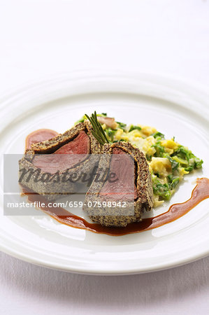 Venison in a poppy seed crust with savoy cabbage ragout