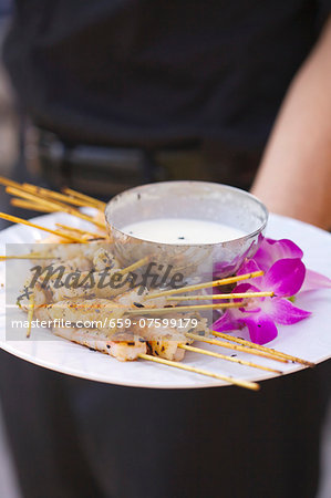 A Platter of Shrimp Skewers with a Yogurt Dip A Platter of Shrimp Skewers with a Yogurt Dip