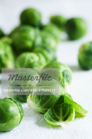 Brussels sprouts on a white surface