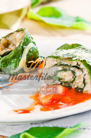 Rolled comfrey with freekeh filling and tomato sauce