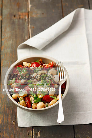 Bean salad with cherry tomatoes, sundried tomatoes, mozzarella and herbs