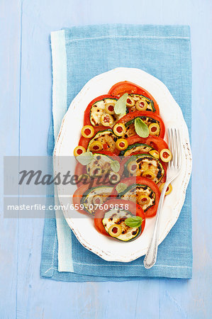 Tomato salad with olives and grilled courgette Tomato salad with olives and grilled courgette