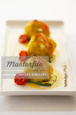 Battered king prawns with cherry tomatoes