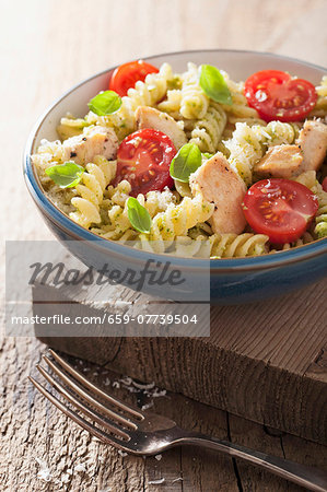 Pasta with chicken, basil pesto and tomatoes