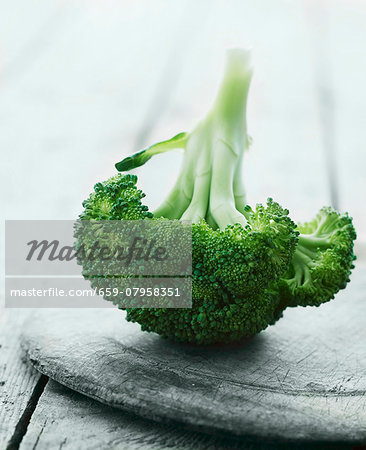 Broccoli on a wooden plate Broccoli on a wooden plate