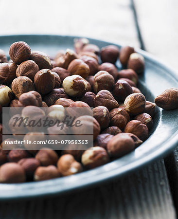 Hazelnuts on a metal plate