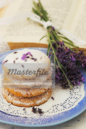 A stack of lavender biscuits on a plate