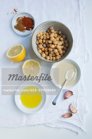 Ingredients for hummus: chickpeas, tahini, garlic, lemon, olive oil, paprika and cumin Ingredients for hummus: chickpeas, tahini, garlic, lemon, olive oil, paprika and cumin