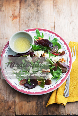 Mixed leaf salad with rocket, Stilton cheese, walnuts and grapes