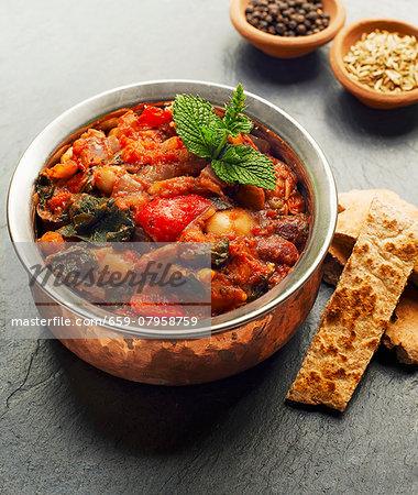 A casserole made with beans, peppers and spinach