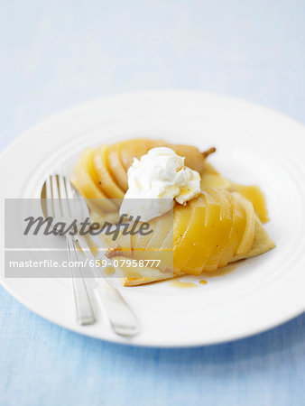 Pear tartlets topped with whipped cream