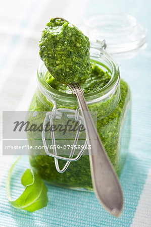 Rocket pesto in a jar and on a spoon