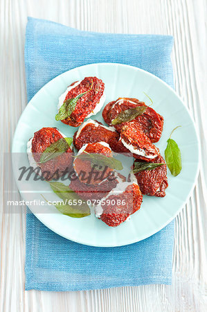 Dried tomatoes stuffed with feta and fried sage