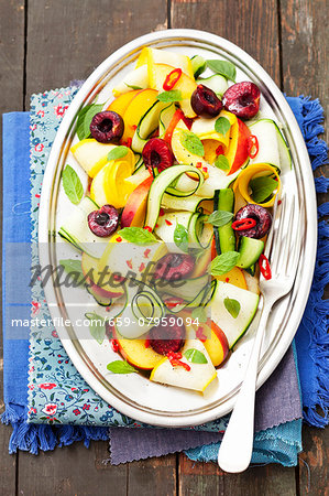 Courgette salad with nectarines, cherries and chilies