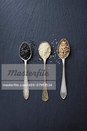 Various types of sesame seeds on three spoons Various types of sesame seeds on three spoons