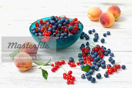 An arrangement of blueberries, redcurrants and peaches An arrangement of blueberries, redcurrants and peaches