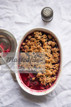 Mixed Berry Crumble in Baking Dish with Spoon