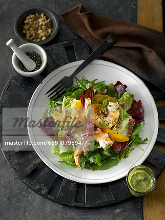 Winter salad with radicchio, shrimps, oranges, pepper and a Dijon mustard dressing