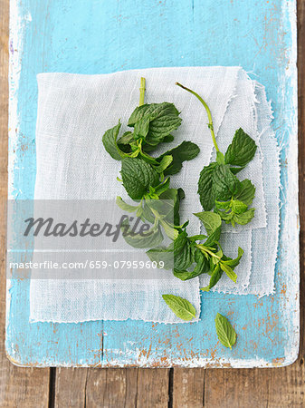 Fresh mint on a blue wooden board