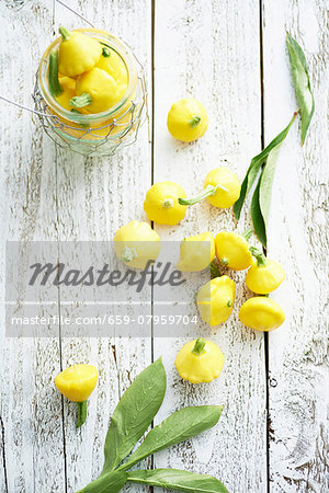 Yellow patty pan squash on a wooden table