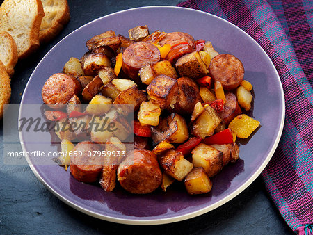 Fried potatoes with sausage, peppers and onions