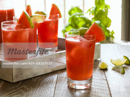 Watermelon cocktails on a rustic wooden tray Watermelon cocktails on a rustic wooden tray