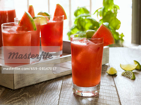 Watermelon cocktails on a rustic wooden tray