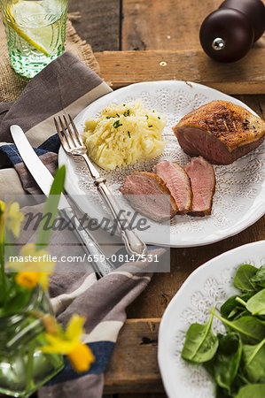 Rare fried duck breast with mashed potatoes Rare fried duck breast with mashed potatoes