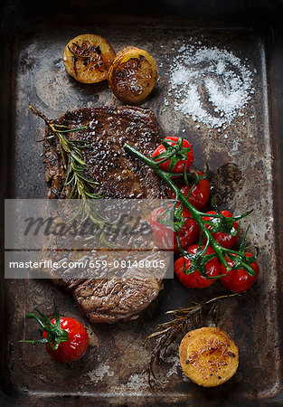 Beef steak with tomatoes and rosemary