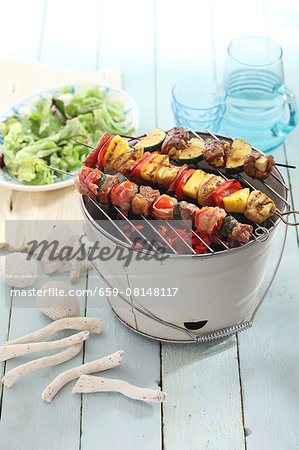 Shish kebabs on a table barbecue with salad Shish kebabs on a table barbecue with salad