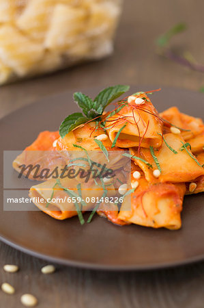 Paccheri with a tomato and ricotta sauce and pine nuts Paccheri with a tomato and ricotta sauce and pine nuts
