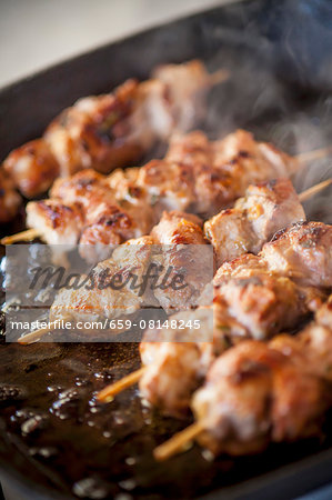 Veal kebabs being fried