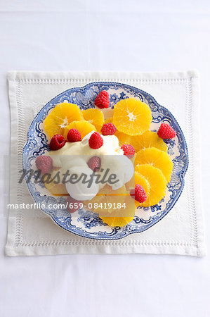 Orange salad with vanilla ice cream and orange cream Orange salad with vanilla ice cream and orange cream