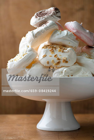 A pile of meringues with flaked almonds
