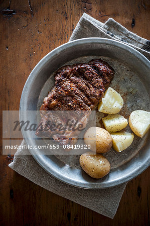 Grilled ribeye steak with potatoes Grilled ribeye steak with potatoes