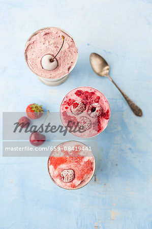 Strawberry ice, cherry ice cream and raspberry ice cream in metal cups (seen from above) Strawberry ice, cherry ice cream and raspberry ice cream in metal cups (seen from above)