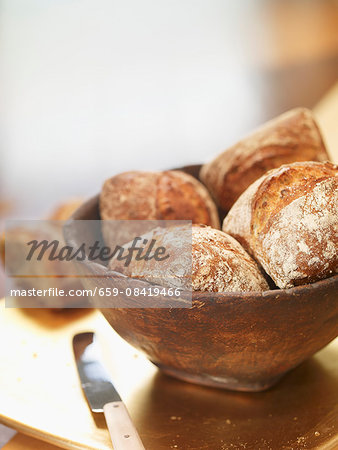 Bread rolls in a wooden bowl