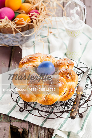 A traditional Easter nest bread with an Easter egg