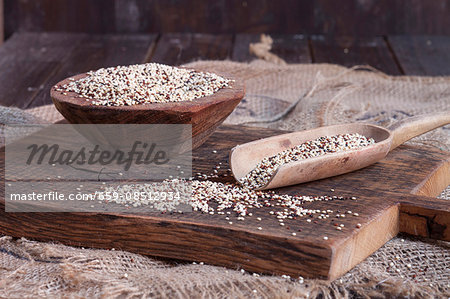 Tricoloured quinoa on a wooden board