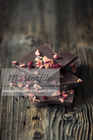 Pieces of chocolate with dried cranberries Pieces of chocolate with dried cranberries
