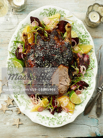 Roast duck served with roasted beetroot